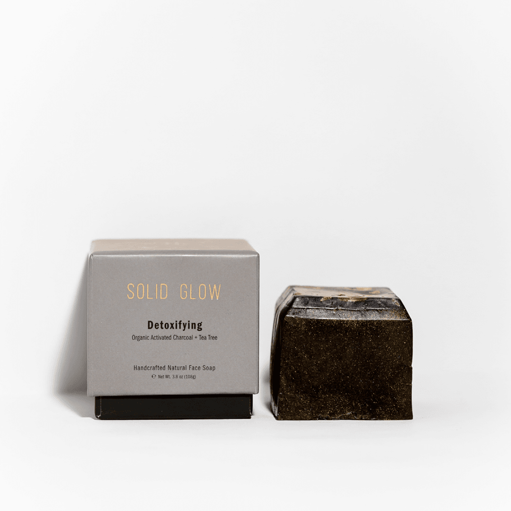 Solid Glow - Detoxifying Natural Face Soap (Charcoal + Tea Tree) | SWAY's Solid Glow are handcrafted facial soaps that look and smell as delicious as desserts. Infused with organic activated charcoal, this detoxifying facial bar draws out impurities and excess oils from deep within your pores.